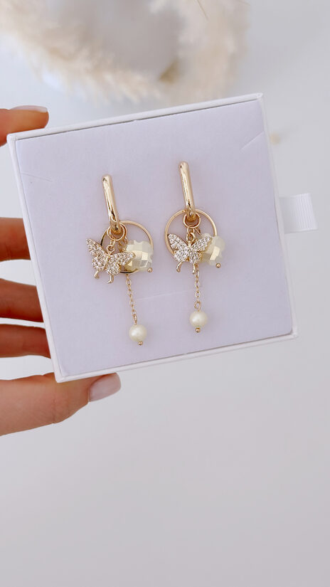 Pasteļu dzelteni Taurentiņu auskari ar kuloniem