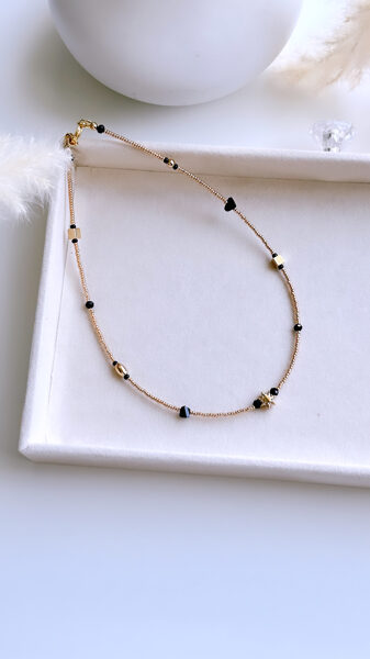 Čokeris Saules (zelts ar melnu)